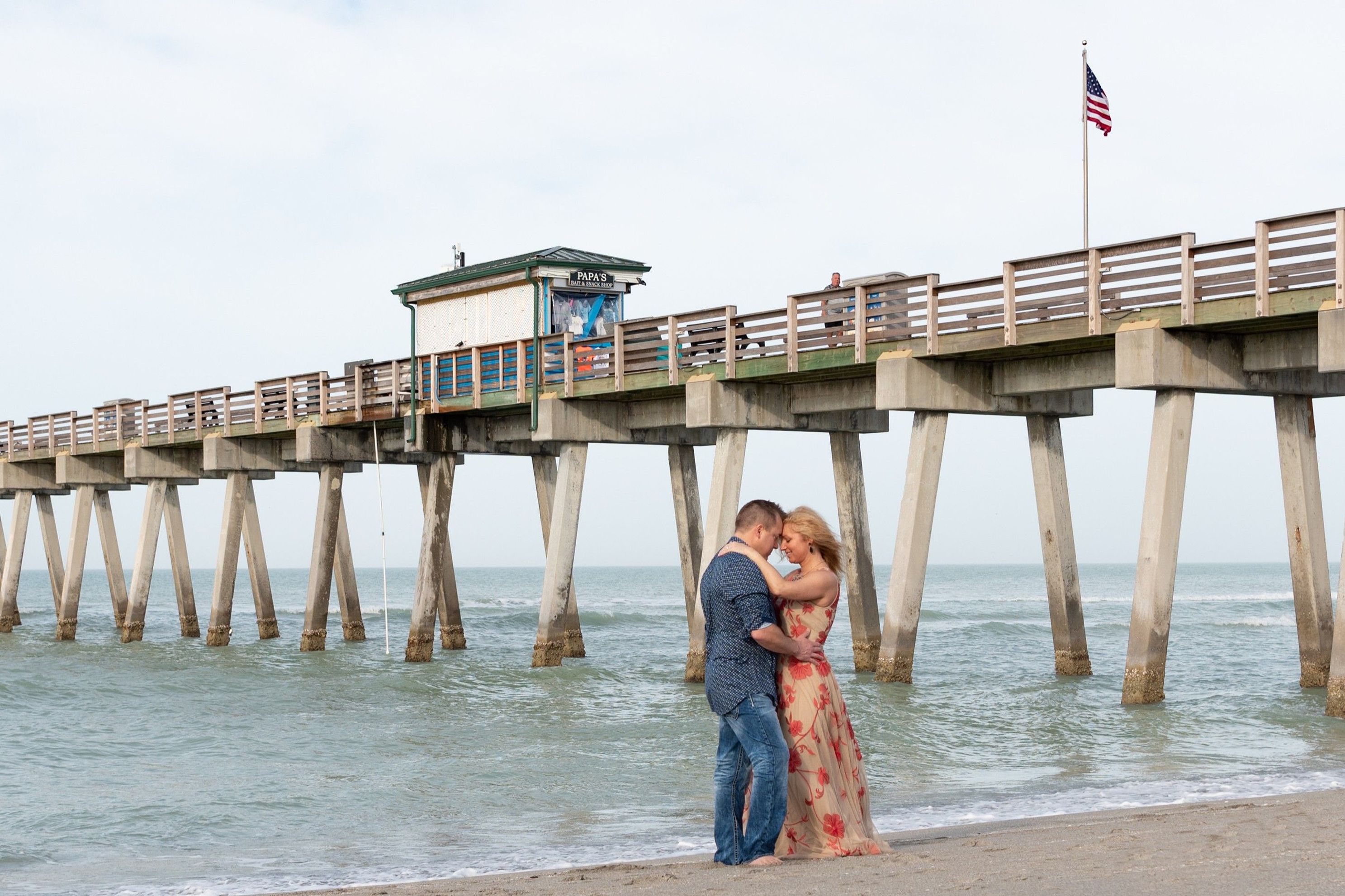 Venice Fl photo of couple on beach in front of pier