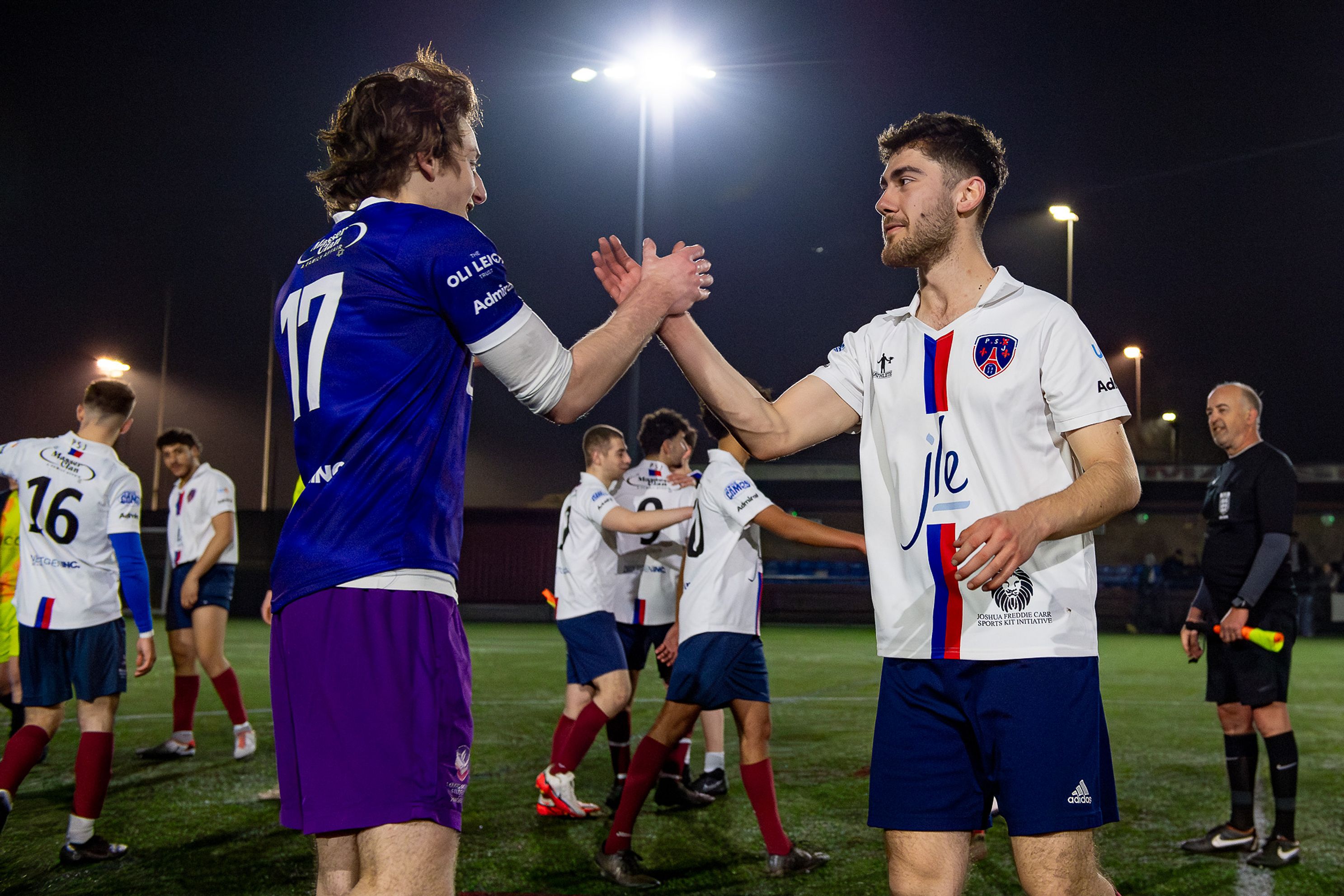 Post-match handshake captured by Bristol sports photographer at PSJ FC vs Maccabi clash, Mar 2025.