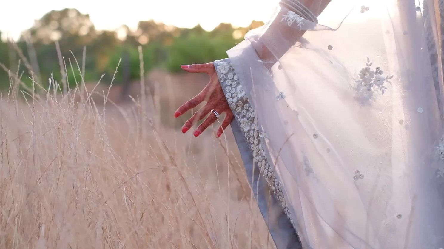 cropped-view-of-an-indian-bride-in-nature-touching-2025-12-17-15-06-13-utc.mov